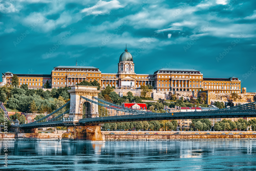 Budapest Royal Castle and Szechenyi Chain Bridge at day time from Danube river, Hungary.