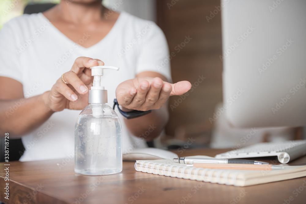 Female washing hand by sanitizer gel for prevention coronavirus disease (COVID-19) before work from home. Female washing hand by sanitizer gel for prevention coronavirus disease (COVID-19) before work from home.