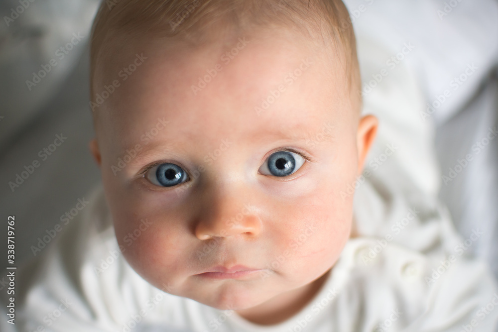 Cute baby boy portrait, baby with blue eyes looking Cute baby boy portrait, baby with blue eyes looking