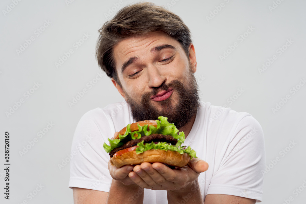 young man eating a sandwich