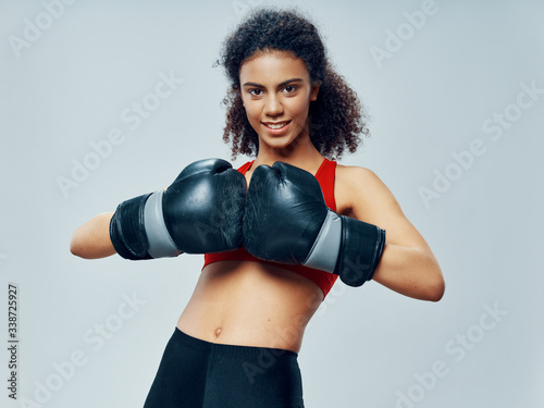 young woman with boxing gloves © SHOTPRIME STUDIO