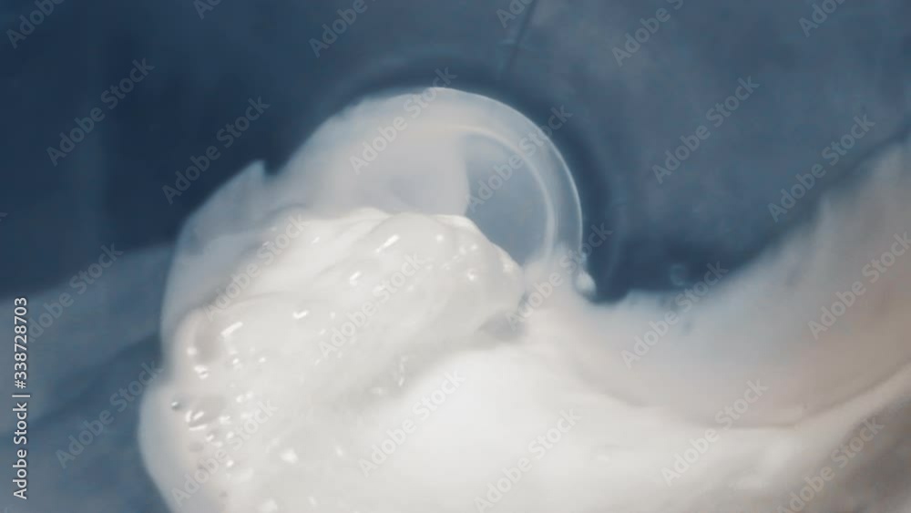 Milk stream flows through the bottle and runs outside in slow motion, macro video from inside the bottle with probe lens, Full HD 240 fps Prores HQ 10 bit Milk stream flows through the bottle and runs outside in slow motion, macro video from inside the bottle with probe lens, Full HD 240 fps Prores HQ 10 bit