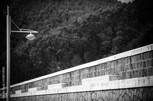 Stylish lantern in the fishing port. Armintza village. Basque Country. Northern spain. Black and white image