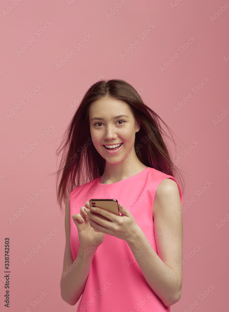 A cool girl blogger is happy with her content, which she posted on social networks on her mobile phone. A cool girl blogger is happy with her content, which she posted on social networks on her mobile phone.