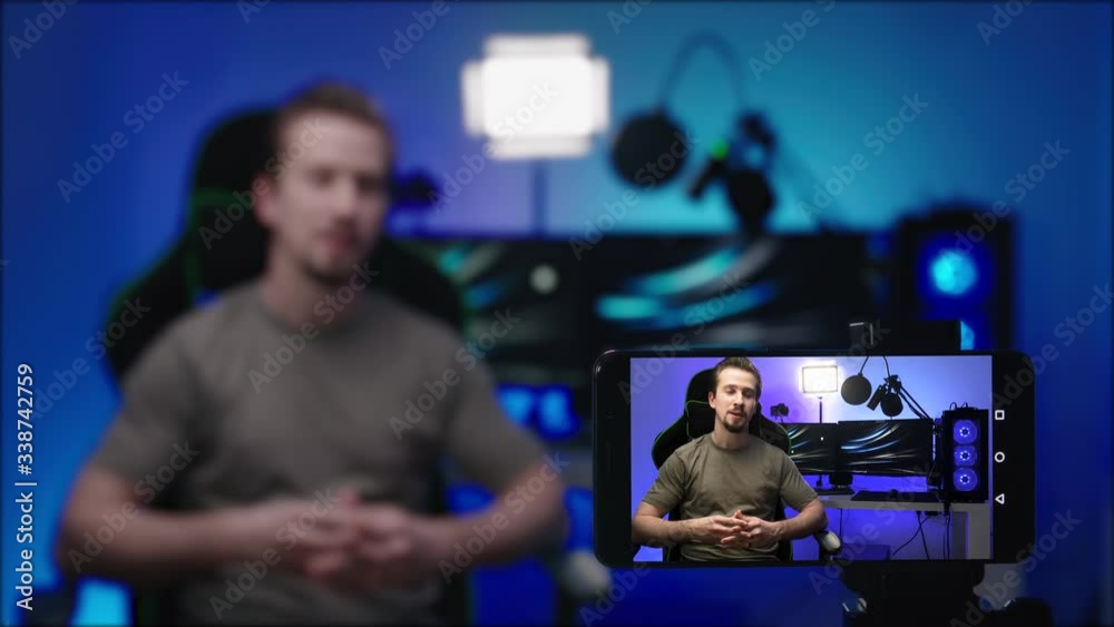 Computer influencer recording video with smartphone template 4K