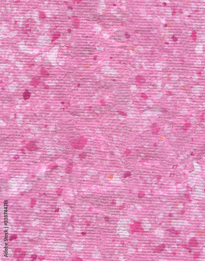 Pink hand-made textured paper spotted seamless background