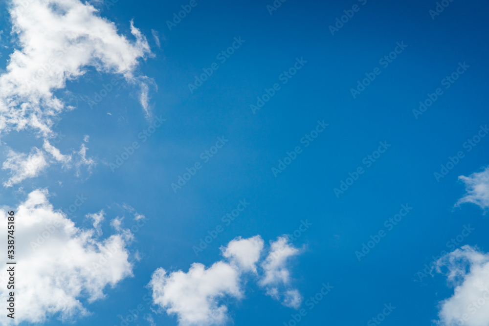 Background nature clear clean blue sky soft clouds beautiful dramatic cloudscape summer sun ray light presents beautiful day life after storm. use as overlay effect or frame with center copy space Background nature clear clean blue sky soft clouds beautiful dramatic cloudscape summer sun ray light presents beautiful day life after storm. use as overlay effect or frame with center copy space