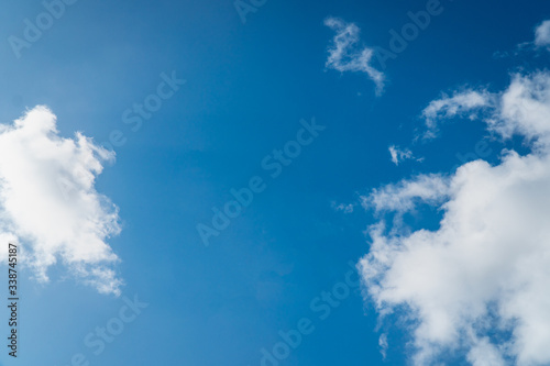 Background nature clear clean blue sky soft clouds beautiful dramatic cloudscape summer sun ray light presents beautiful day life after storm. use as overlay effect or frame with center copy space 