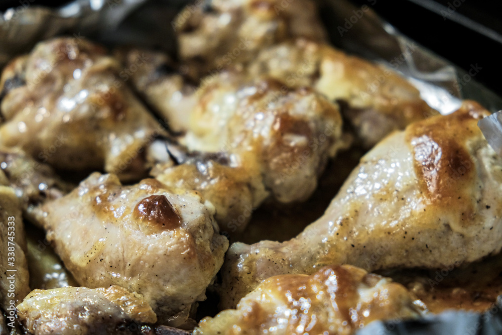 Golden chicken legs in batter fried in a pan Golden chicken legs in batter fried in a pan