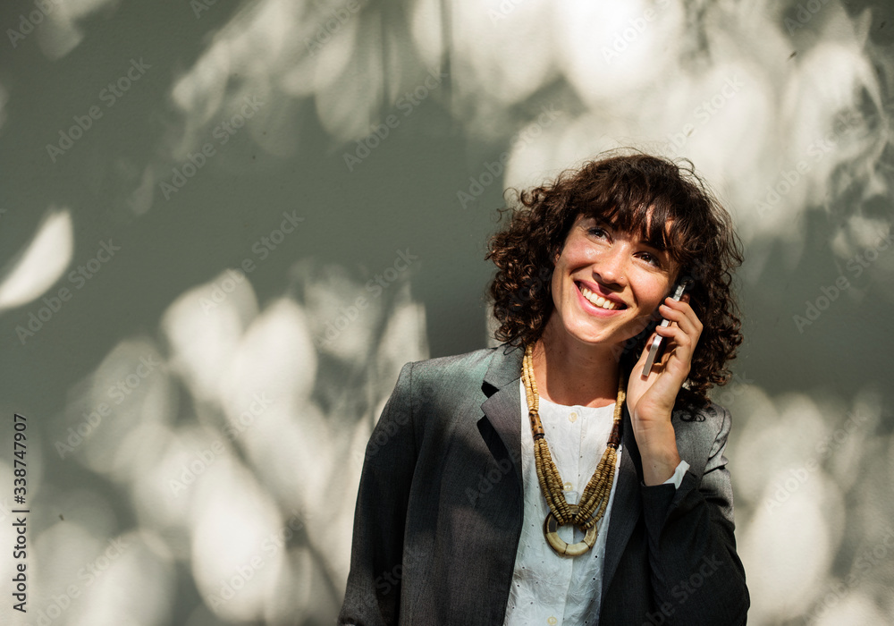 Businesswoman using mobile phone communication technology Businesswoman using mobile phone communication technology