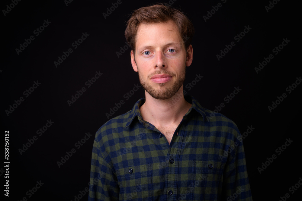 Face of bearded hipster man looking at camera
