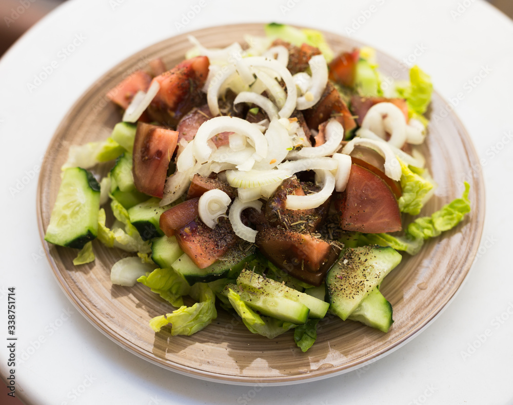 vegetarian healthy vegetable salad on brown plate vegetarian healthy vegetable salad on brown plate