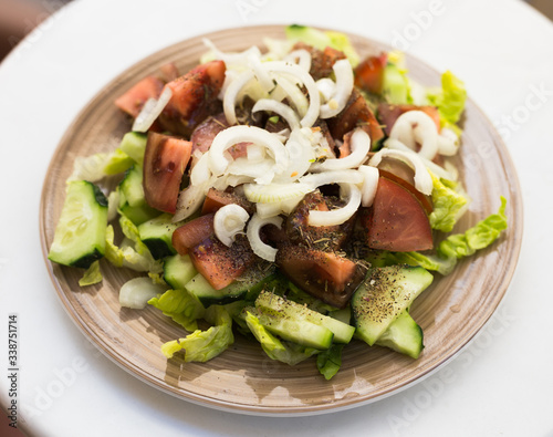 vegetarian healthy vegetable salad on brown plate