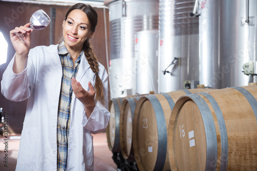 woman in white coat on the winery