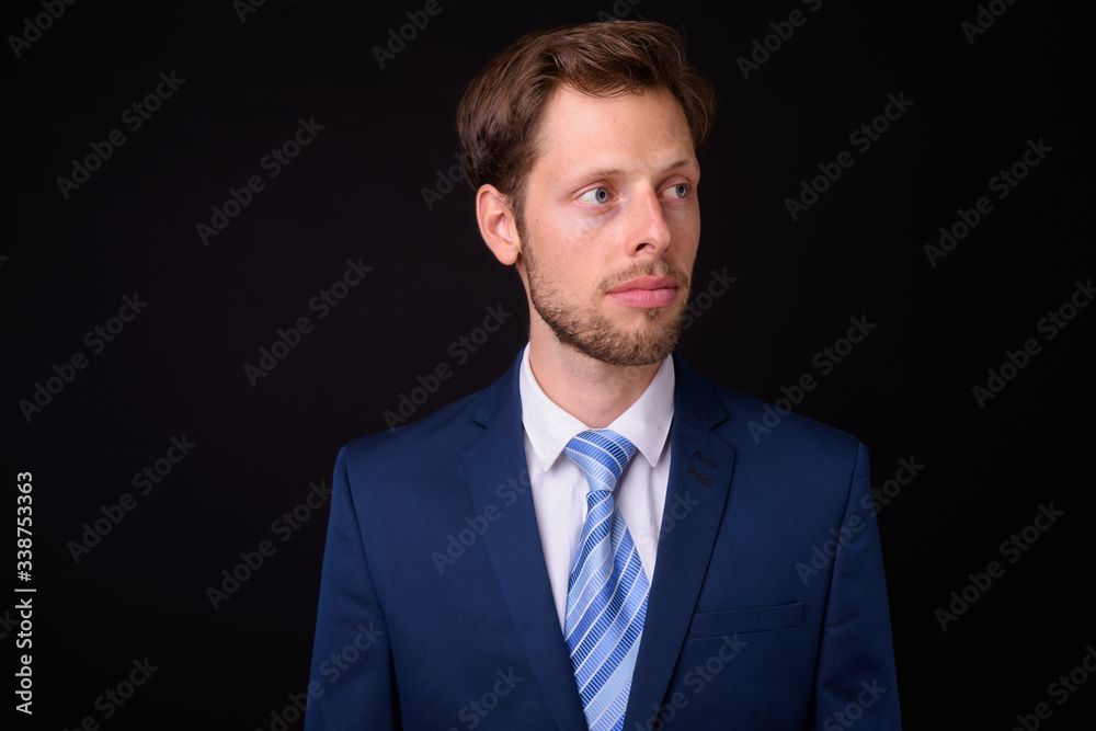 Face of bearded businessman in suit thinking Face of bearded businessman in suit thinking