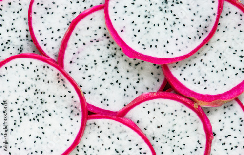 Closeup of dragon fruit slices background