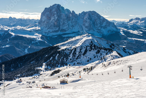 Snowy landscape in the Italian Alps - ski resort with many ski tracks and snowy tops. Italian Dolomites / Dolomiti  © miladrumeva