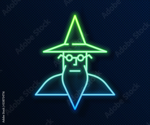 Glowing neon line Wizard warlock icon isolated on blue background.  Vector Illustration