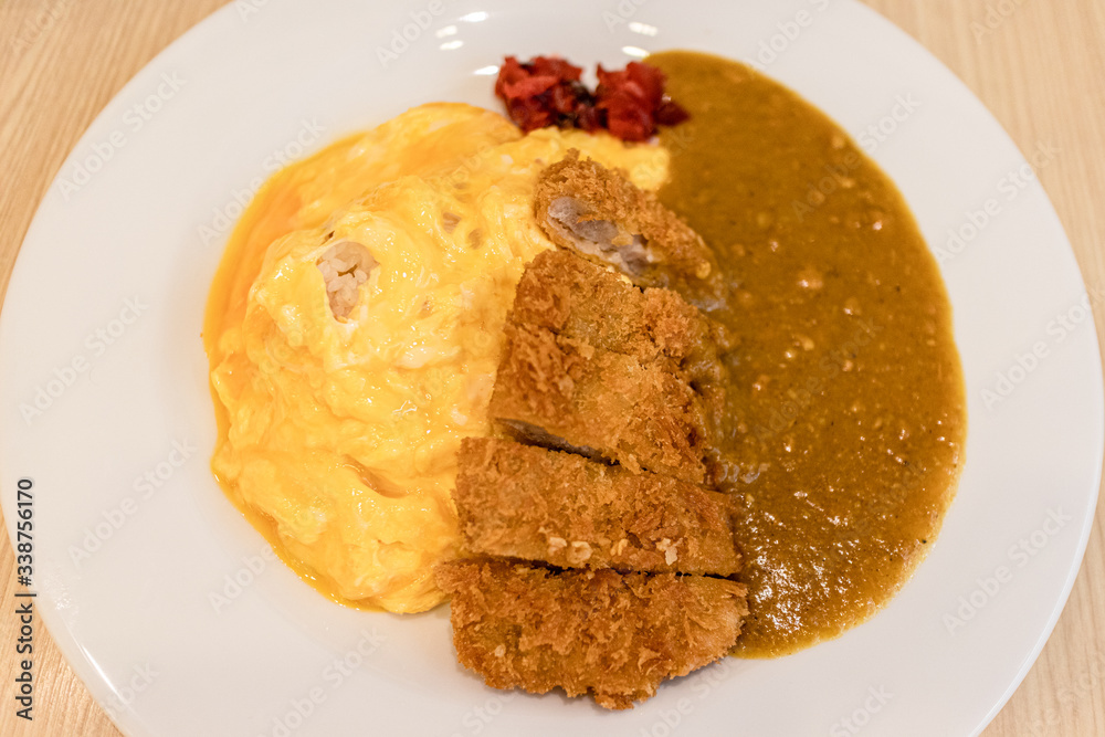 Japanese beef curry rice served on the table in the restaurant. Japanese beef curry rice served on the table in the restaurant.