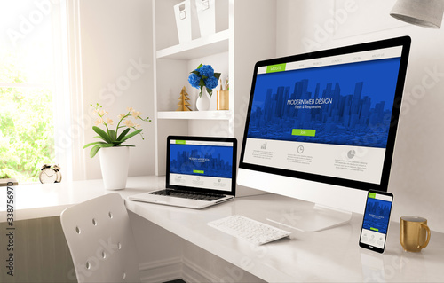 home office setup with responsive design on screen © MclittleStock