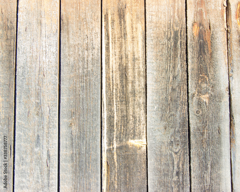 Naklejka premium Faded planks arranged vertically, texture of old boards