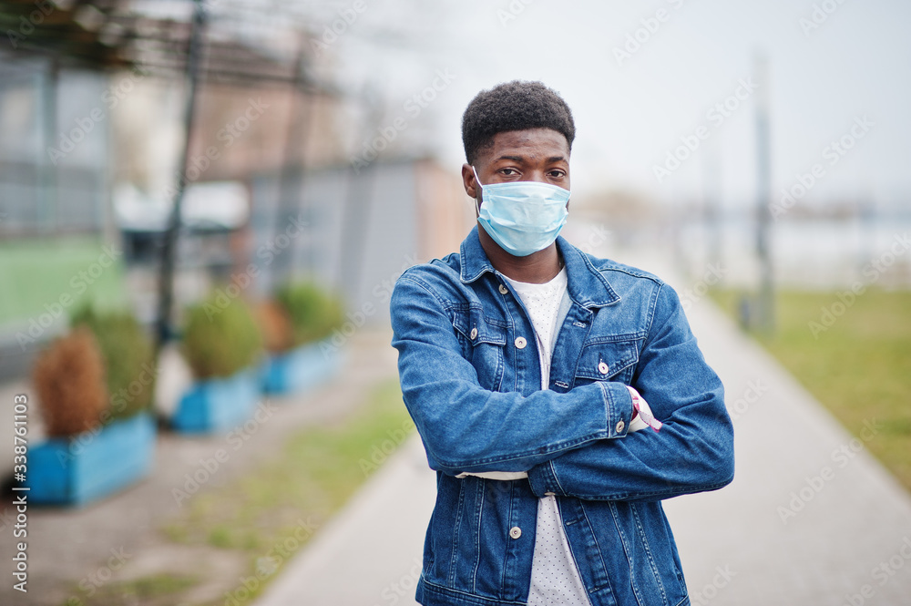 African man at park wearing medical masks protect from infections and diseases coronavirus virus quarantine. African man at park wearing medical masks protect from infections and diseases coronavirus virus quarantine.