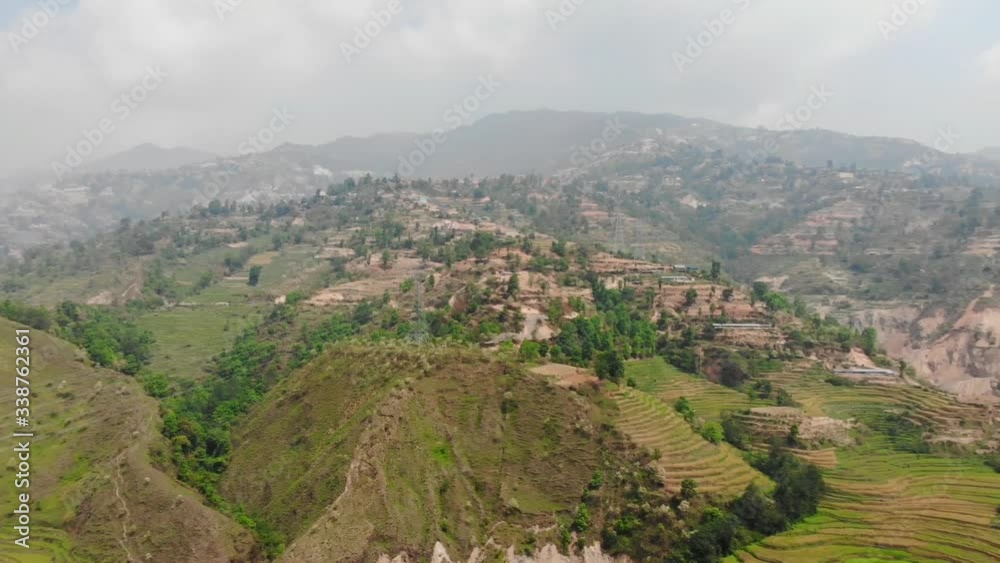 Aerial drone view of villages and green terraced rice patty fields, Nepal Aerial drone view of villages and green terraced rice patty fields, Nepal