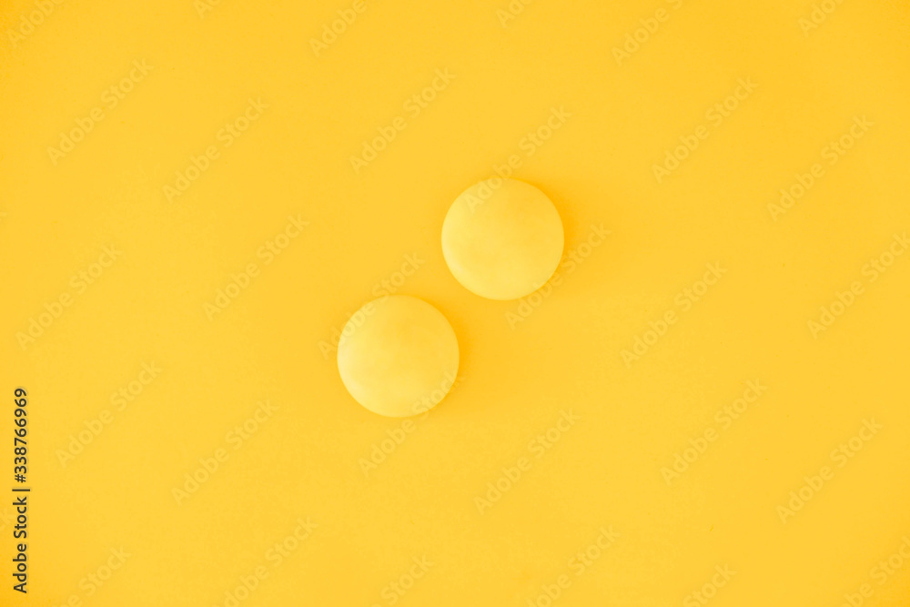 Yellow balls on yellow background. Minimal concept. Top view. Copy, empty space for text