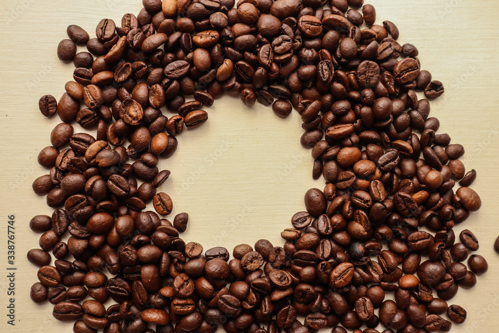 Coffee grains with space for text on brown paper background Coffee grains with space for text on brown paper background