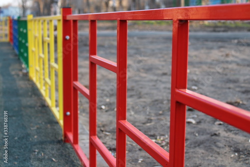 multi-colored fence on the Playground © Алексей Анисимов