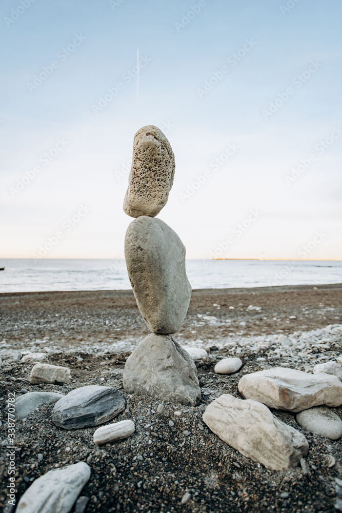 The figure of stones standing on each other, on the beach against the sea. The figure of stones standing on each other, on the beach against the sea.