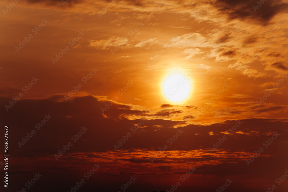 Beautiful sunset. Orange sunset. The moon at sunset