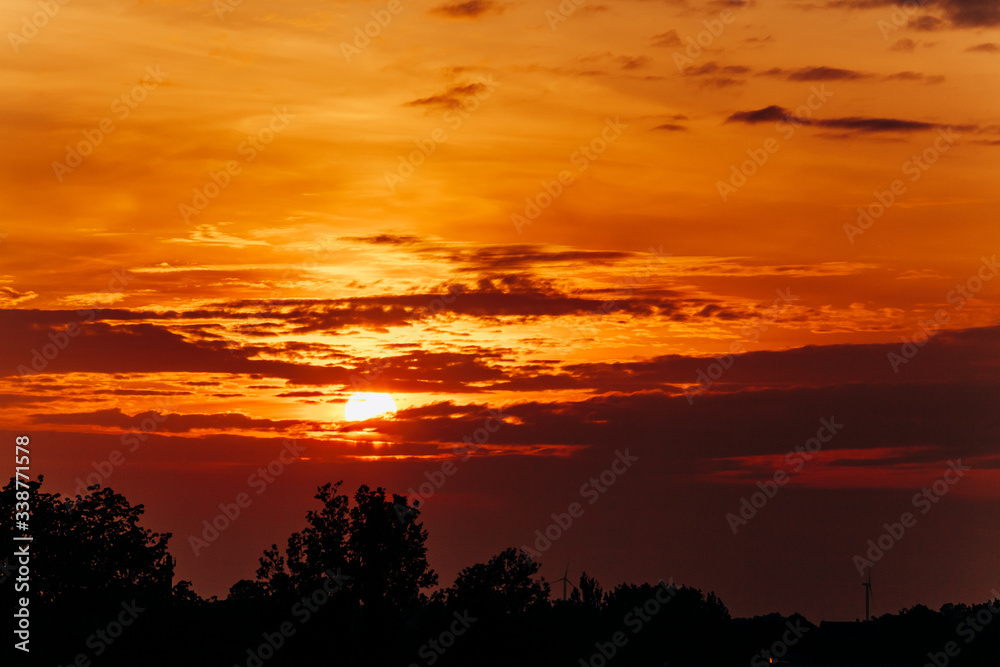 Obraz premium Beautiful sunset. Orange sunset. The moon at sunset