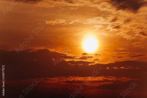 Fototapeta Naklejka Na Ścianę i Meble -  Beautiful sunset. Orange sunset. The moon at sunset
