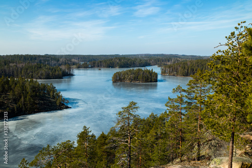 Beautiful landscape with icy lake in the national park Repovesi, Finland