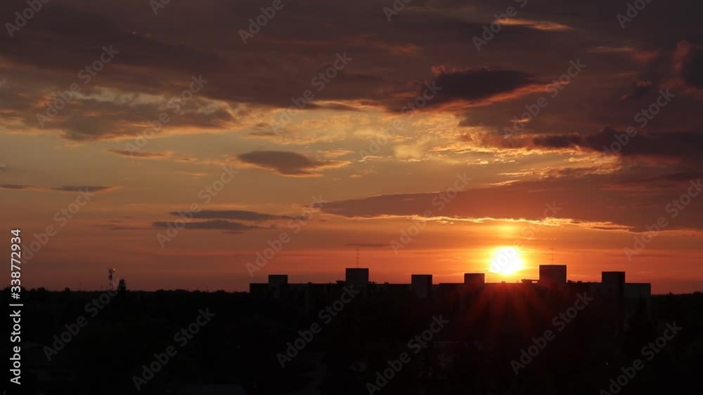 Wide timelapse of sun rising over silhouetted city. Wide timelapse of sun rising over silhouetted city.