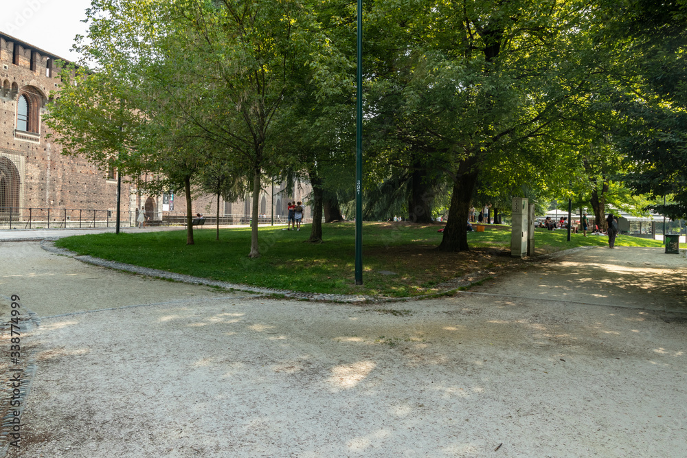MILAN, ITALY - Aug 1, 2019: Beautiful Park of Sforza Castle XV century - Castello Sforzesco. It is one of the main symbols of the city of Milan, Lombardy, Italy