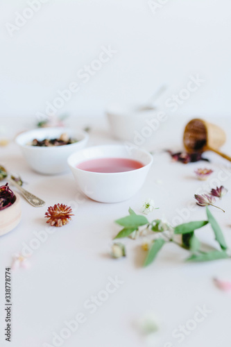 varieties of dry tea, herbal, green, black tea and fruit tea on antique silver teaspoons