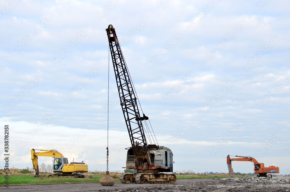 Large crawler crane or dragline excavator with a heavy metal wrecking