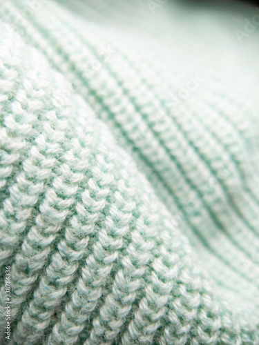Macro close up on soft knitted fabric texture detail background