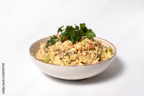 Olivier salad - a classic recipe with mayonnaise, an incredible taste. Olivier salad on a white background, homemade recipe.