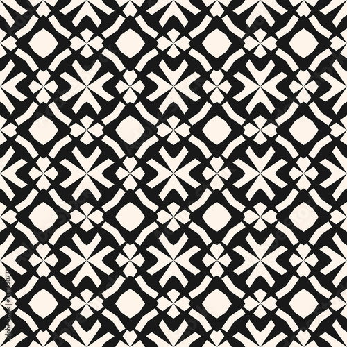 Vector monochrome ornamental pattern in ethnic style. Traditional folk motif. Abstract geometric seamless texture with floral shapes, grid, lattice. Black and white repeat background. Elegant design