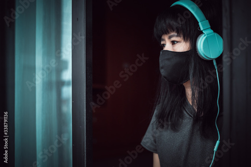 Asian woman wearing a black...