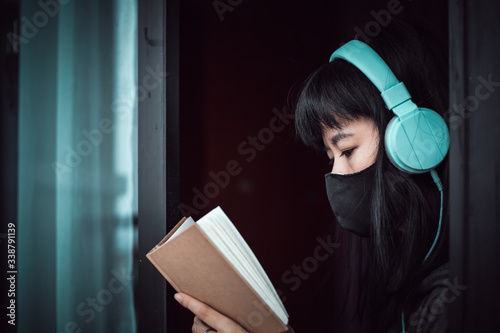 Asian woman wearing a black...