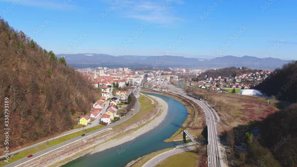 High aerial establishing shot of river, mountains and town of Celje, Slovenia High aerial establishing shot of river, mountains and town of Celje, Slovenia