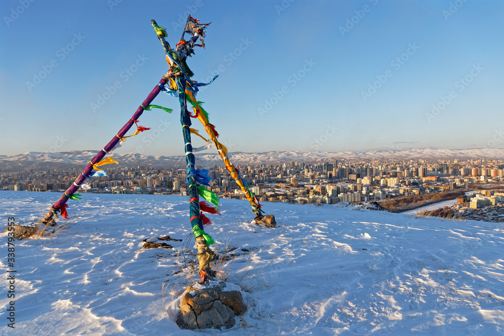 Fototapeta premium Ovoo on a hill over the city of Ulaan Baatar, the mongolian capital