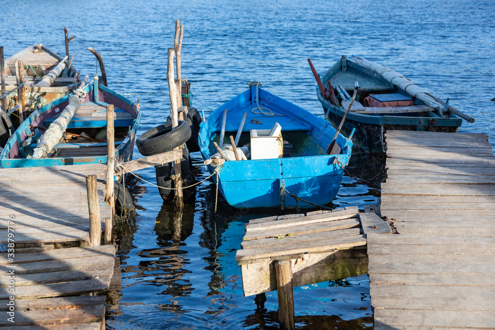 Detail of some boats floating in the pier of Playa Larga, a little town in the south of Cuba Detail of some boats floating in the pier of Playa Larga, a little town in the south of Cuba