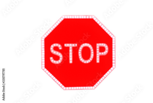 Stop sign isolated on white background. Led leght road sign. photo