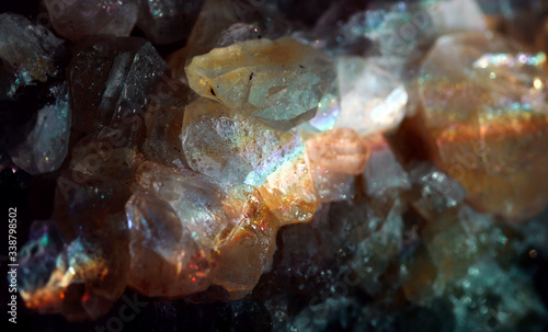 Amazing natural light reflections on healing Smokey Quartz wild jewels. Texture of gemstone with rainbow effect.