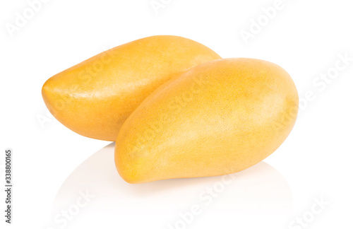 Closeup ripe mango tropical fruit with leaves isolated on white background